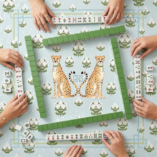 Custom mahjong mat with twin cheetahs, green botanical print, and geometric border