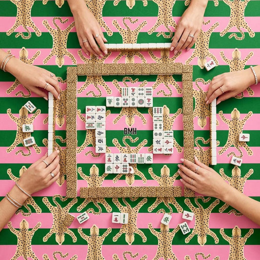 Custom Mahjong mat with green, pink and tan spotted pattern, set with tiles
