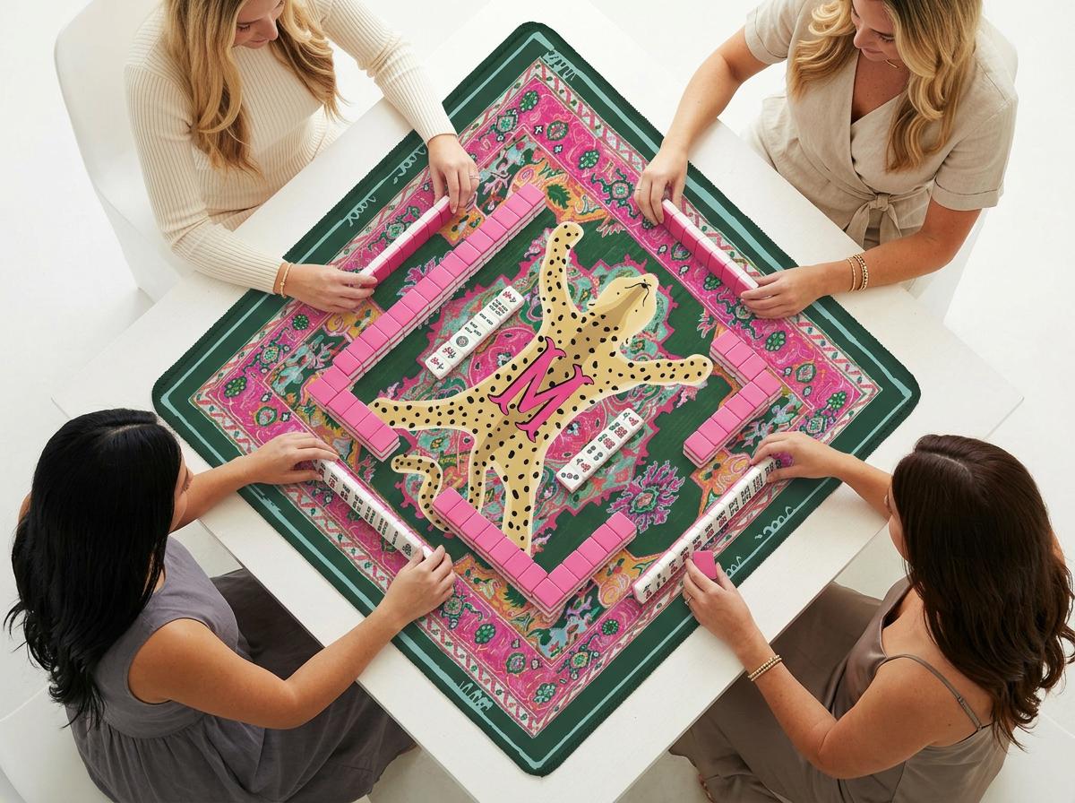 Custom mahjong mat with a pink floral border and a spotted leopard design, shown during play