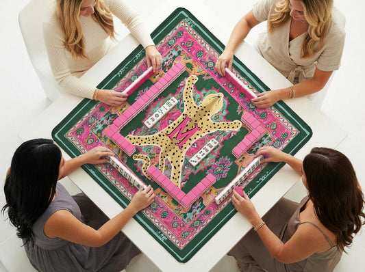 Custom mahjong mat with a pink floral border and a spotted leopard design, shown during play