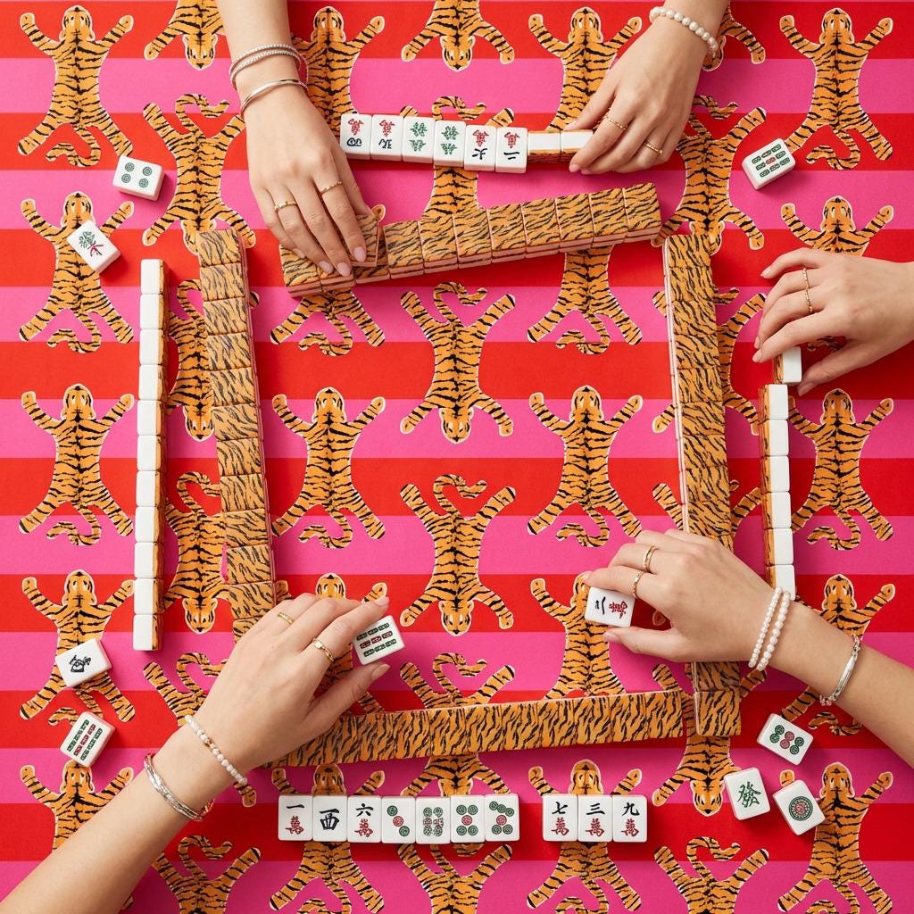 Custom Mahjong mat with a vivid pink and red tiger-print surface, shown in use with tiles.