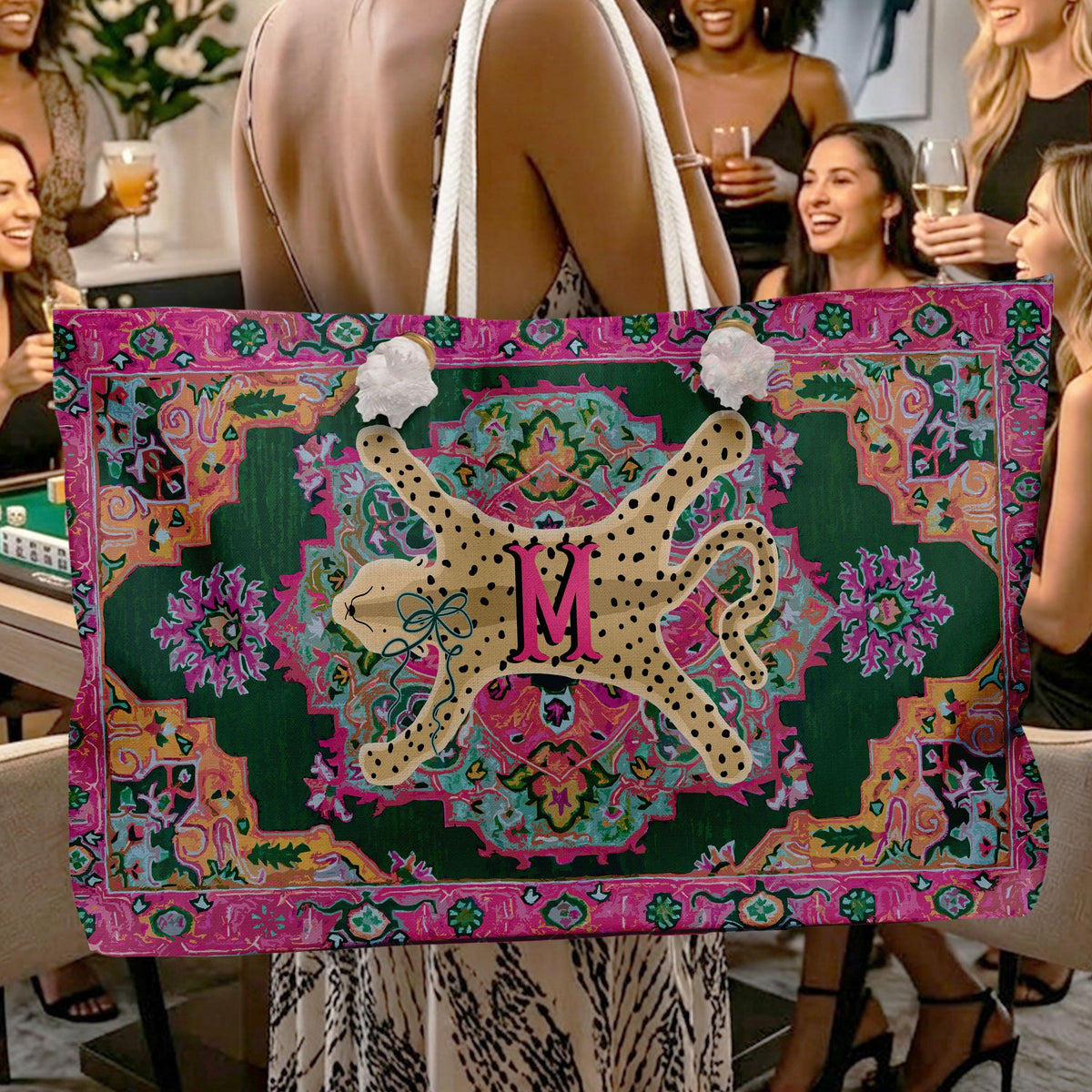 Mahjong tote bag with white rope handles, colorful ornate print, and a central M monogram