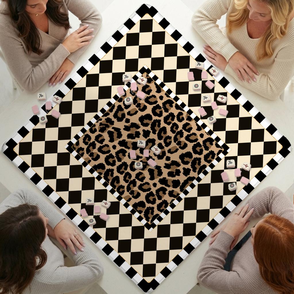 Mahjong mat with a leopard-print center and cream-and-black checkerboard border, scattered tiles