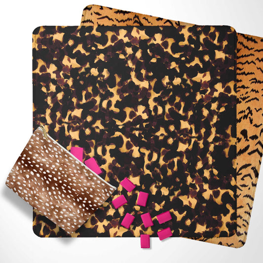 Animal-print mahjong mat set with layered leopard and tiger patterns, drawstring pouch, and tiles