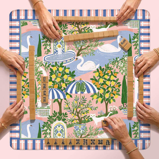 Custom mahjong mat with colorful garden print and plaid border, shown with tiles