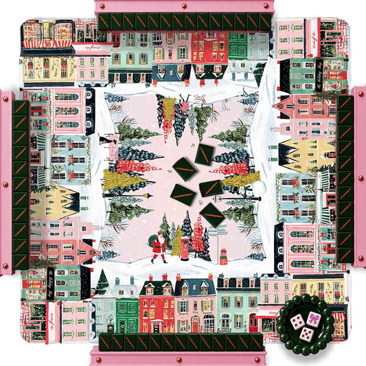 Christmas city-print mahjong mat with buildings, holiday trees, and scattered tiles