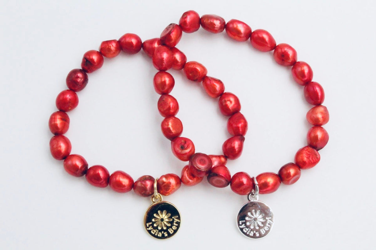 Red freshwater pearl bracelets with gold- and silver-tone floral charms