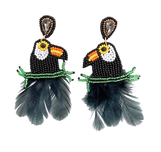 Black beaded toucan dangle earrings with green band, yellow beak, orange accents, gray feather drops