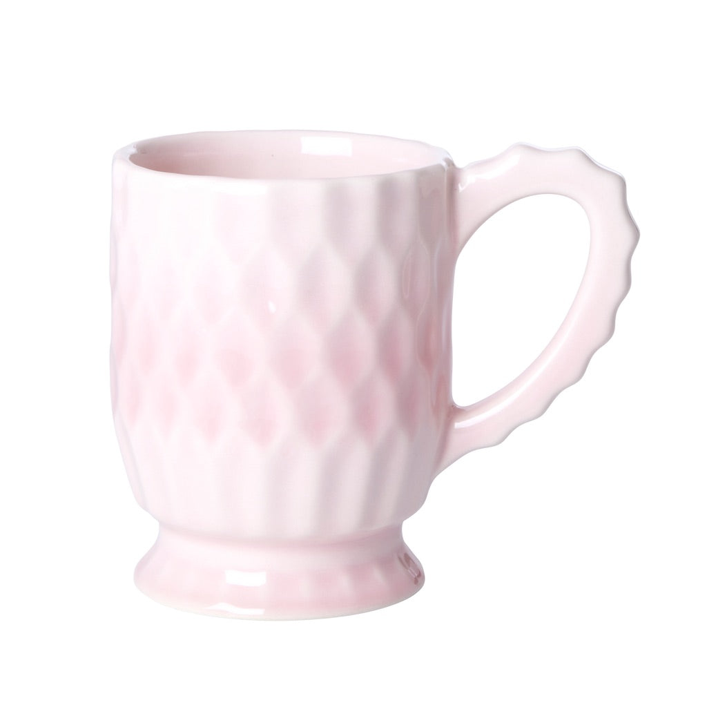 Pink ceramic mug with scalloped handle, glossy finish and raised diamond pattern