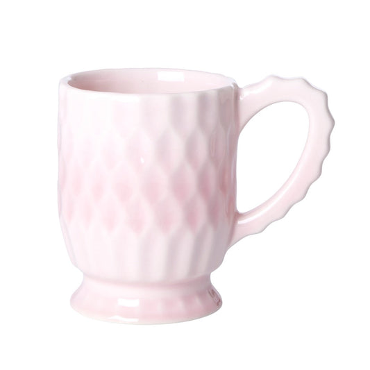 Pink ceramic mug with scalloped handle, glossy finish and raised diamond pattern