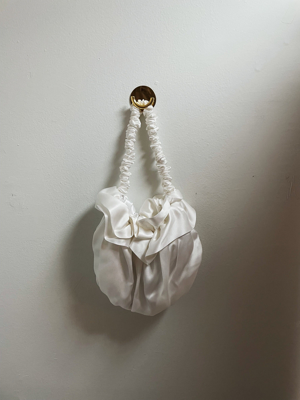 White silk Bloom bag with a ruffled top and gathered handle