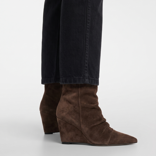 Slouch wedge boots with dark brown suede, worn with jeans; side profile