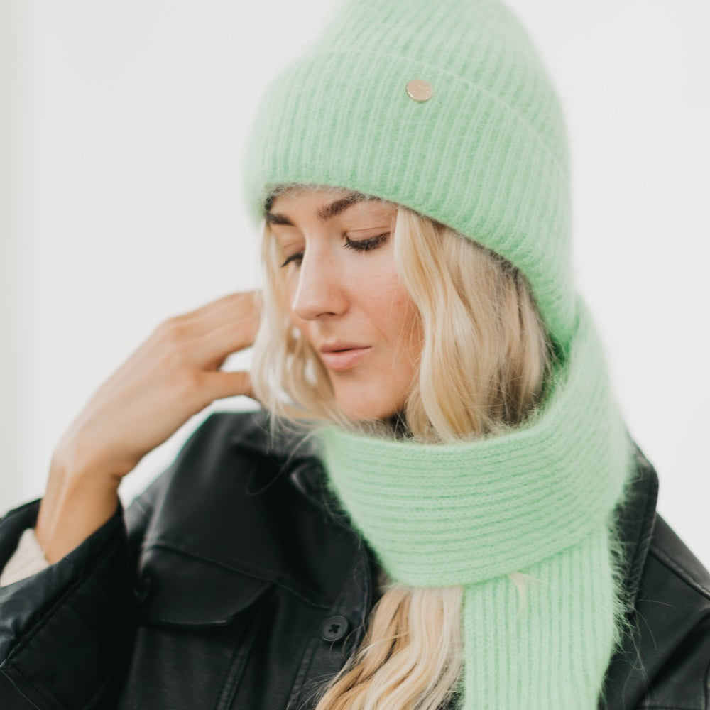 Mint green knitted scarf and beanie set with ribbed texture and round top badge