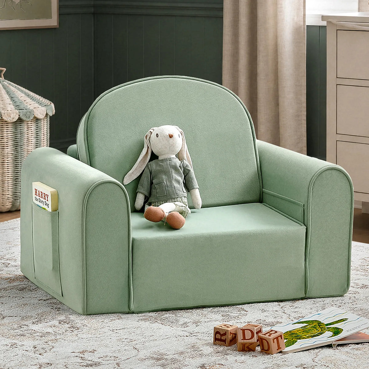 Tiny Land® kids sofa chair in light green with rounded arms, side storage pocket, and plush seat.