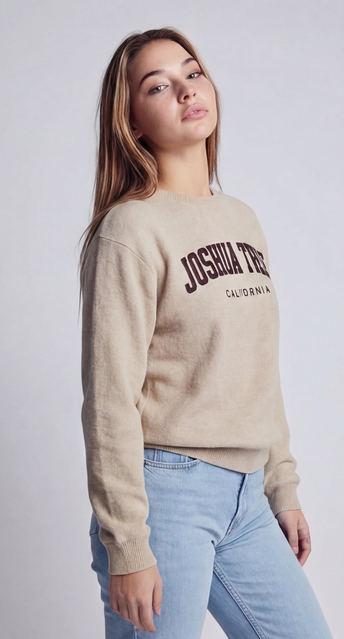 Beige sweatshirt with Joshua Tree California logo on the back, ribbed cuffs and hem