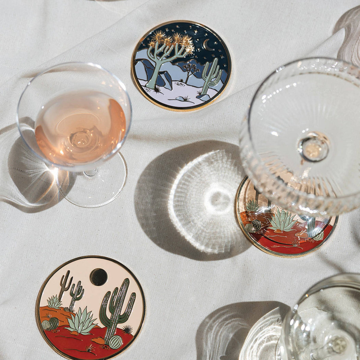 Round coaster with gold rim, cactus desert under moon and stars illustration