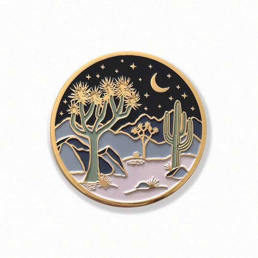 Round gold-edged coaster with starry night desert Joshua trees and moon illustration