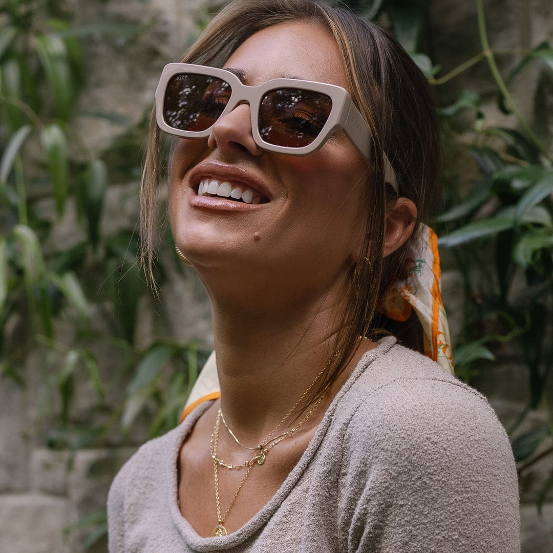 Polarized sunglasses with light almond brown frames and dark brown lenses