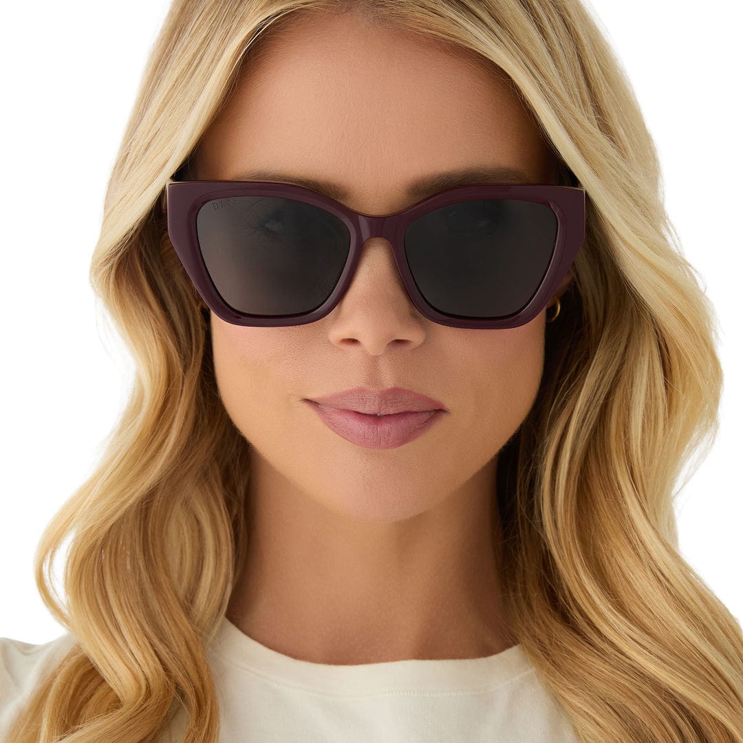 Maroon polarized sunglasses with dark lenses, square cat-eye frame