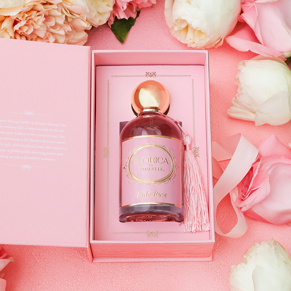 Florica Jude Rose eau de parfum bottle in pink gift box with ribbon and flowers