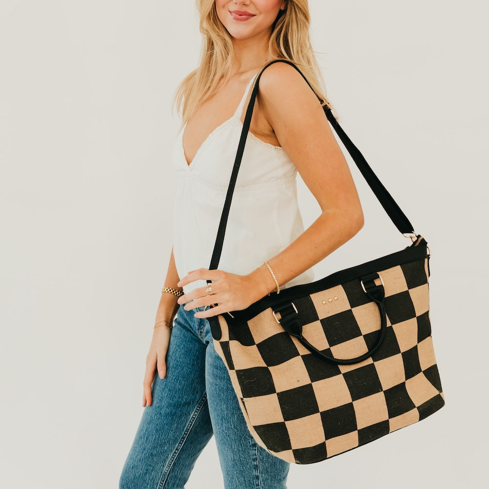 Jute tote bag with black and natural checkered print, shoulder strap and top handles