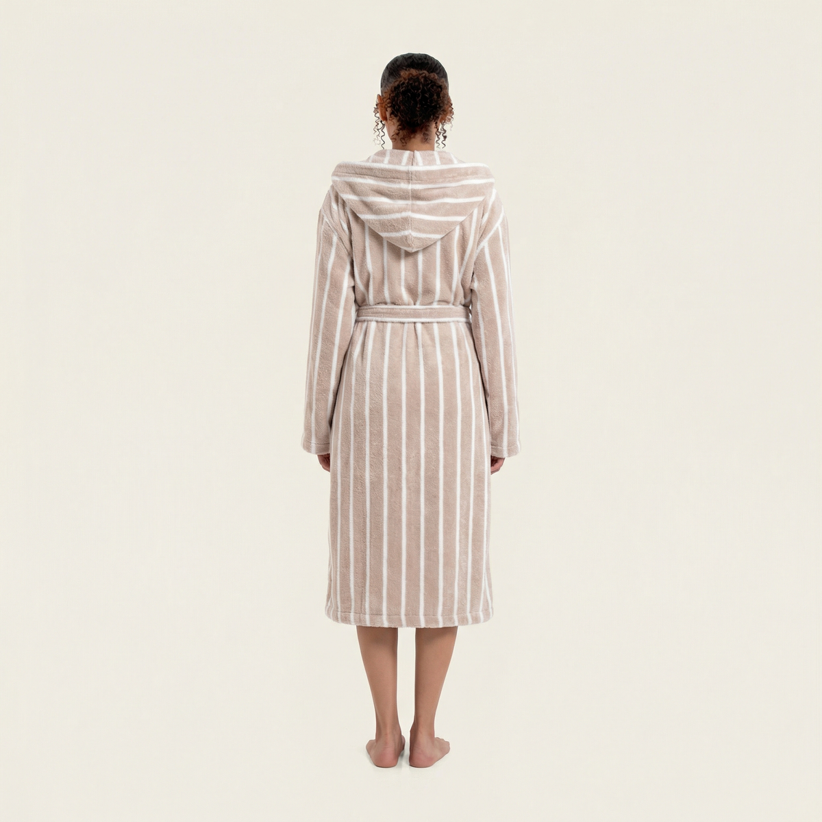 Beige-and-white striped hooded bathrobe back view with tie belt at the waist