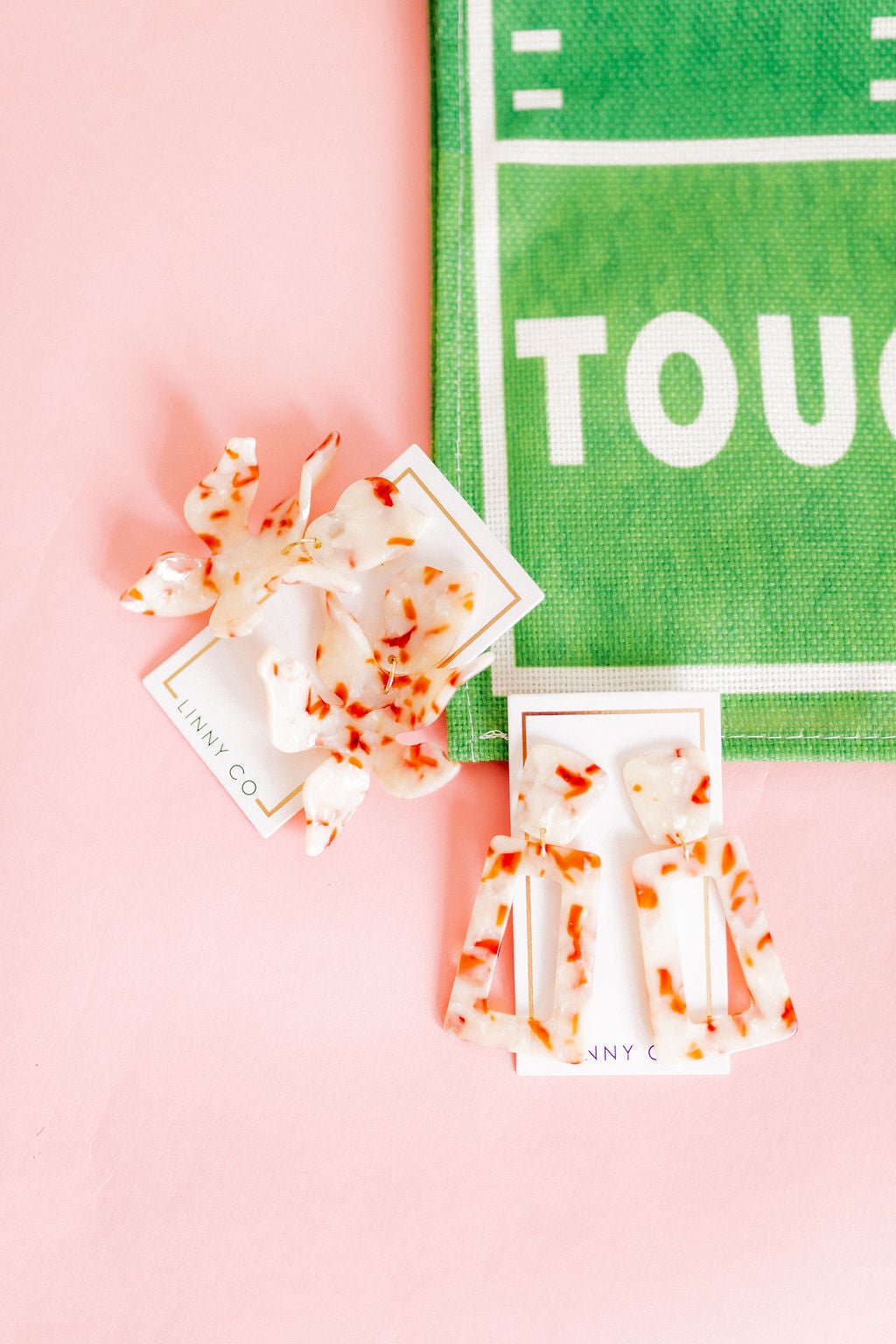 Pair of orange-and-white speckled resin rectangle statement earrings