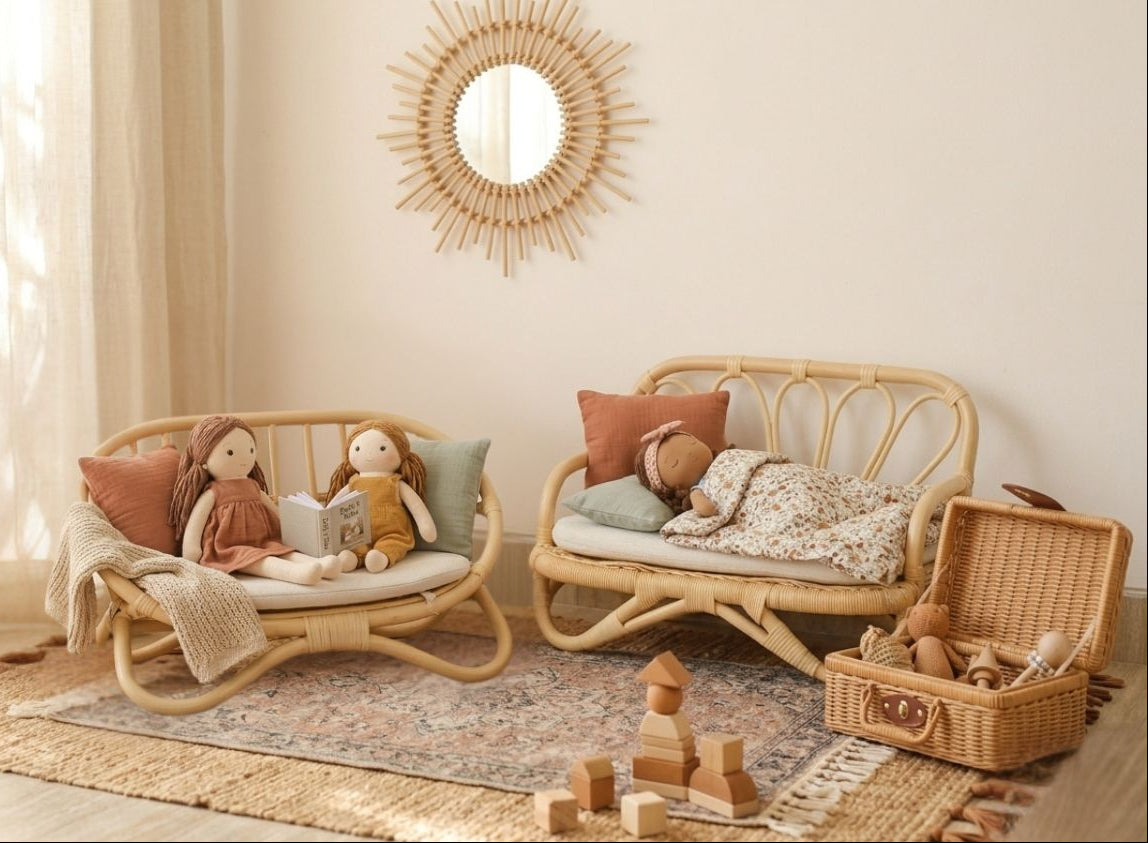 Natural rattan miniature doll couch with curved frame, shown with dolls and a matching sofa