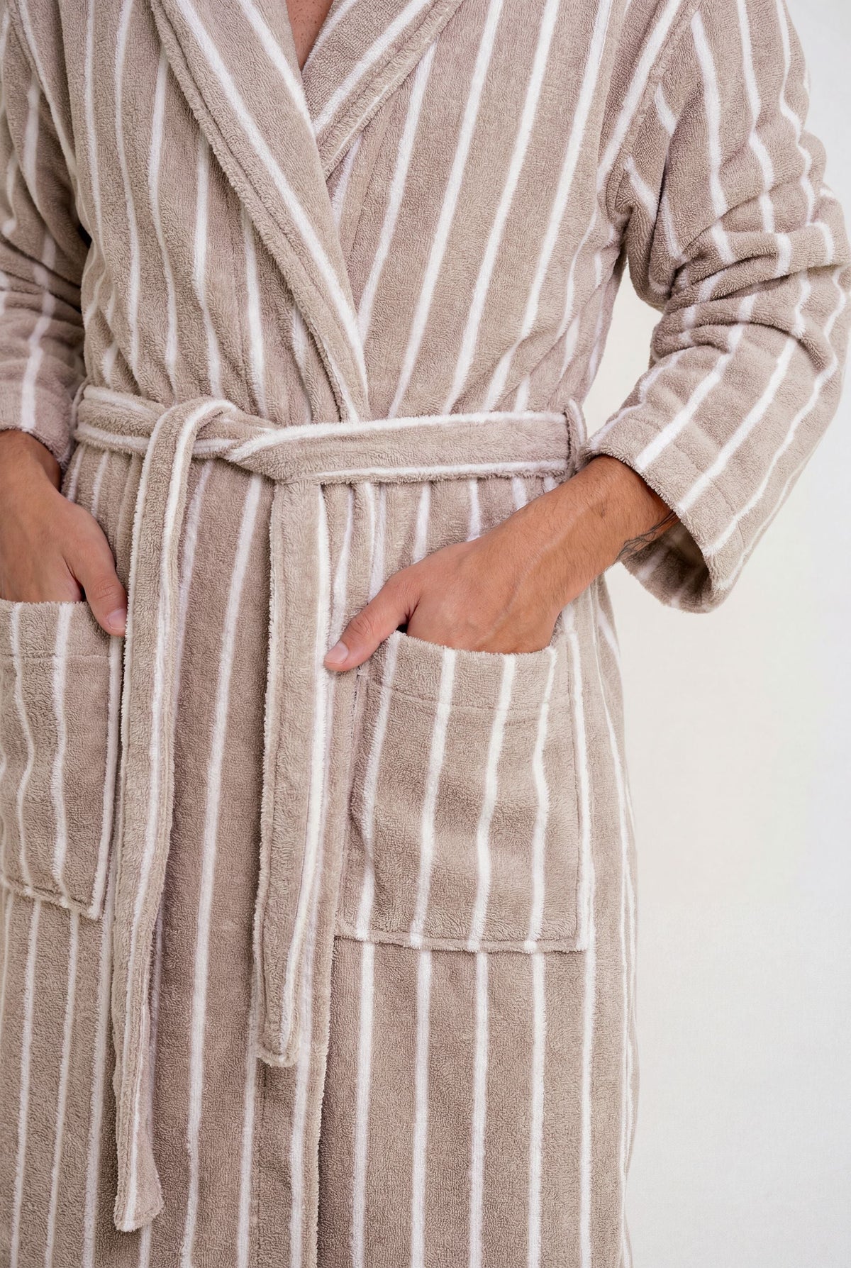 Beige-and-white striped hooded bathrobe close-up: tie belt and front pockets