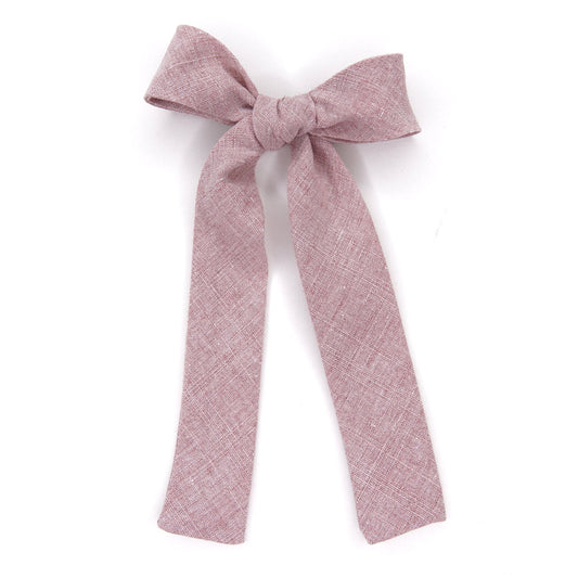 Pink textured fabric hair bow with long tails
