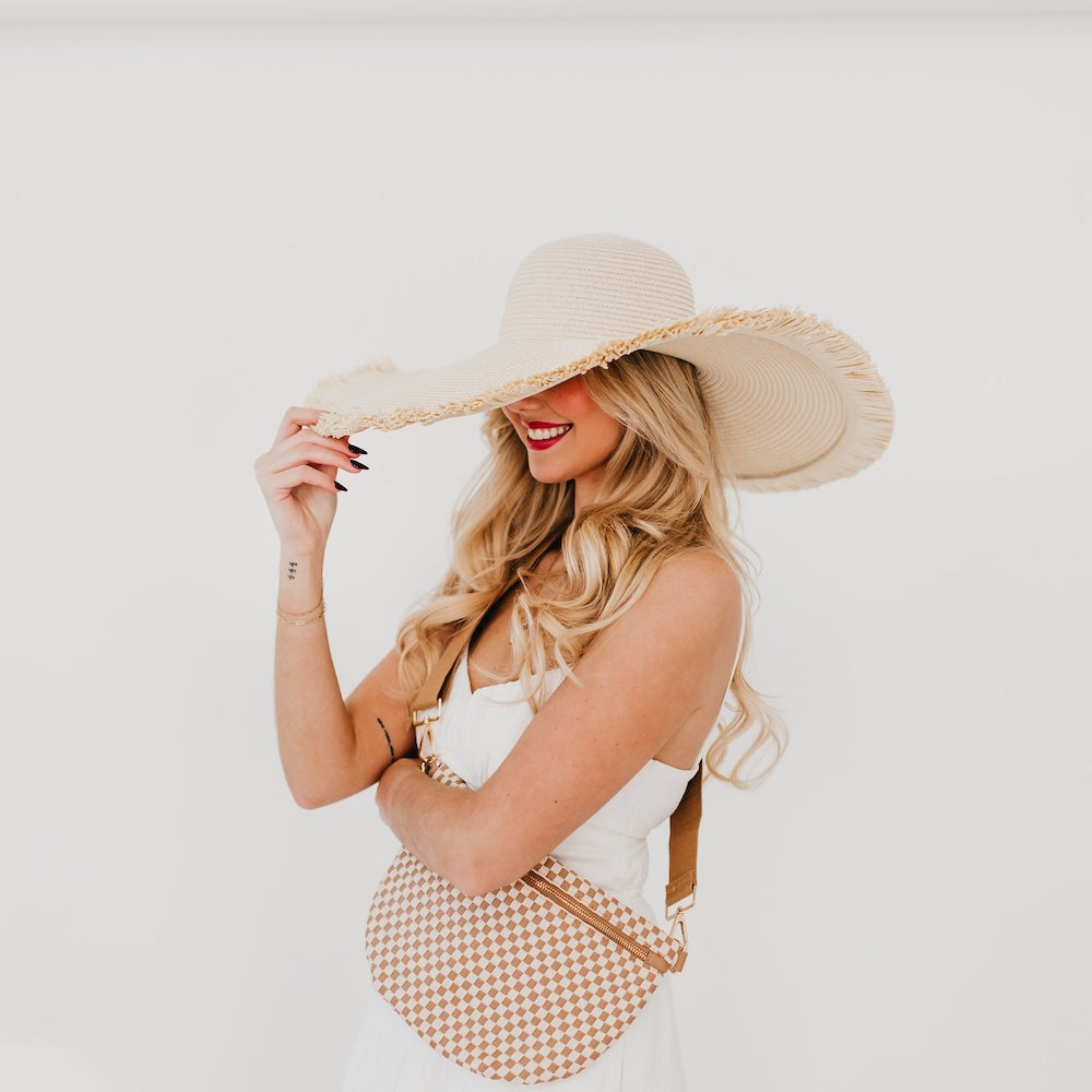 Light beige wide-brim straw hat with frayed fringe edge