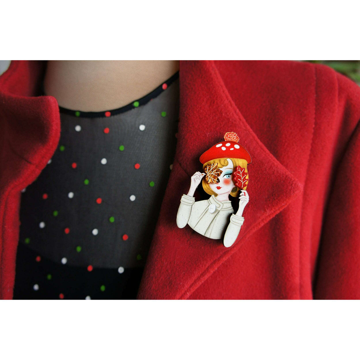 Laliblue autumn girl brooch on red coat, girl with mushroom hat and leaf accents