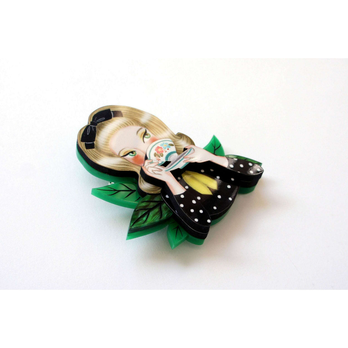 Girl tea-drinking brooch side view with green leaf accents