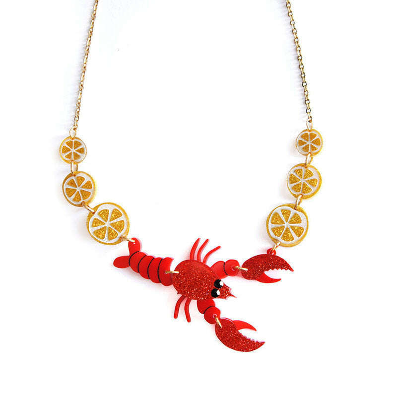Lobster necklace with gold chain, red lobster, and citrus slice charms