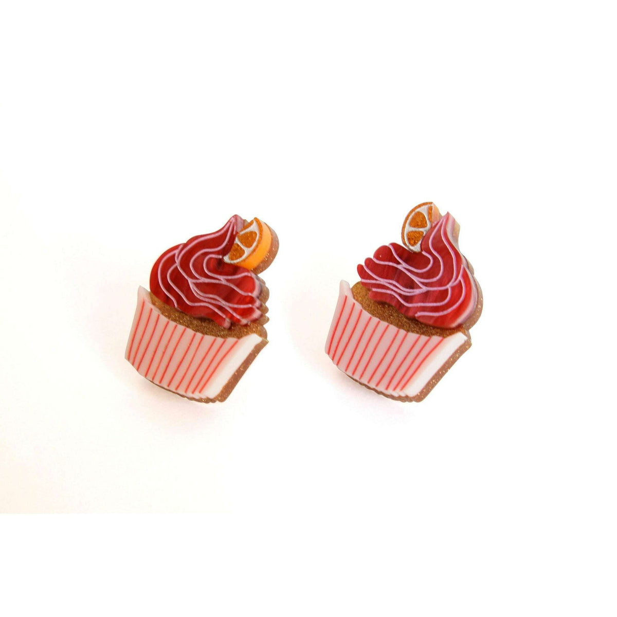 Muffin-shaped stud earrings with red frosting swirls, orange fruit slice, and striped base