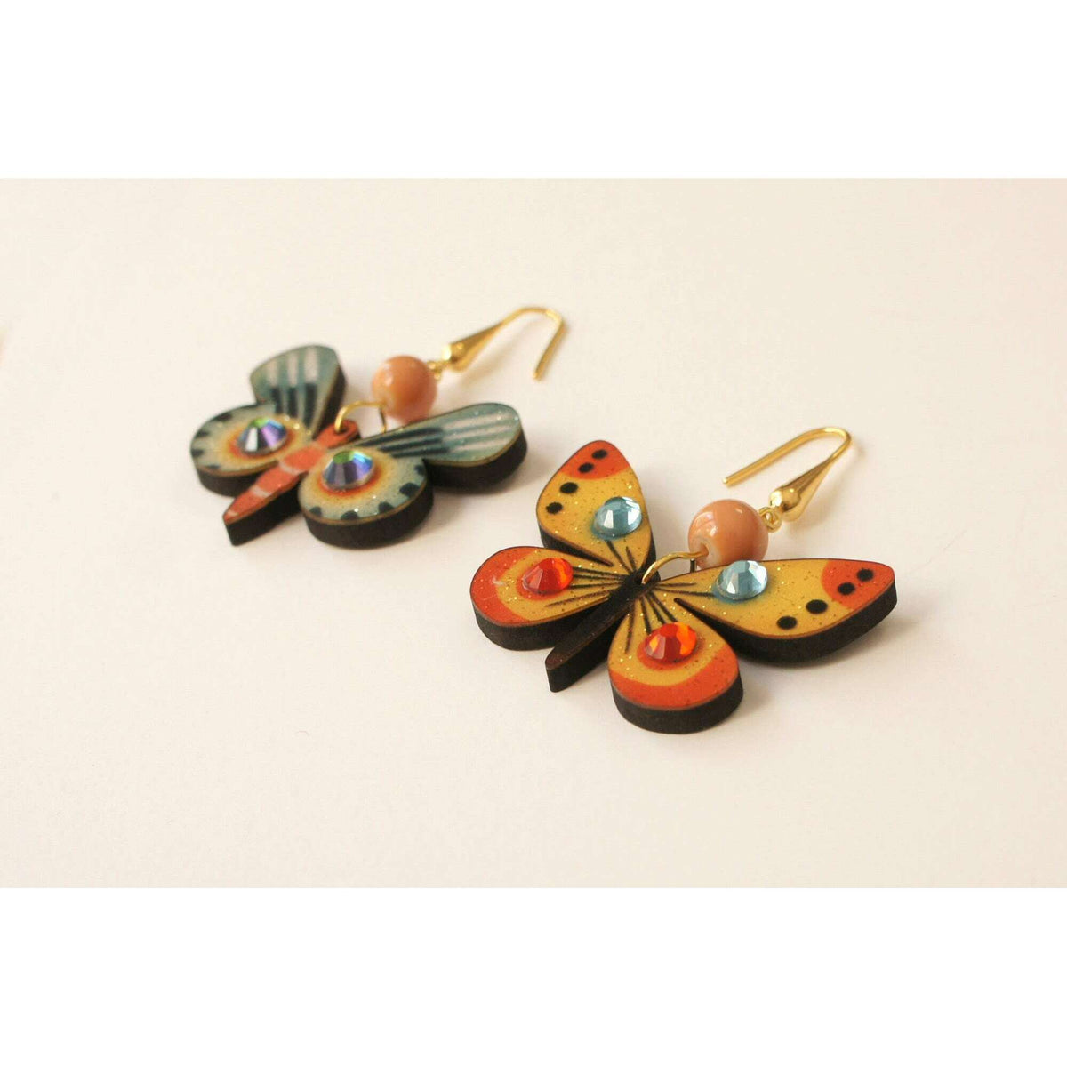Pair of multicolor butterfly drop earrings with gold hooks and bead charms