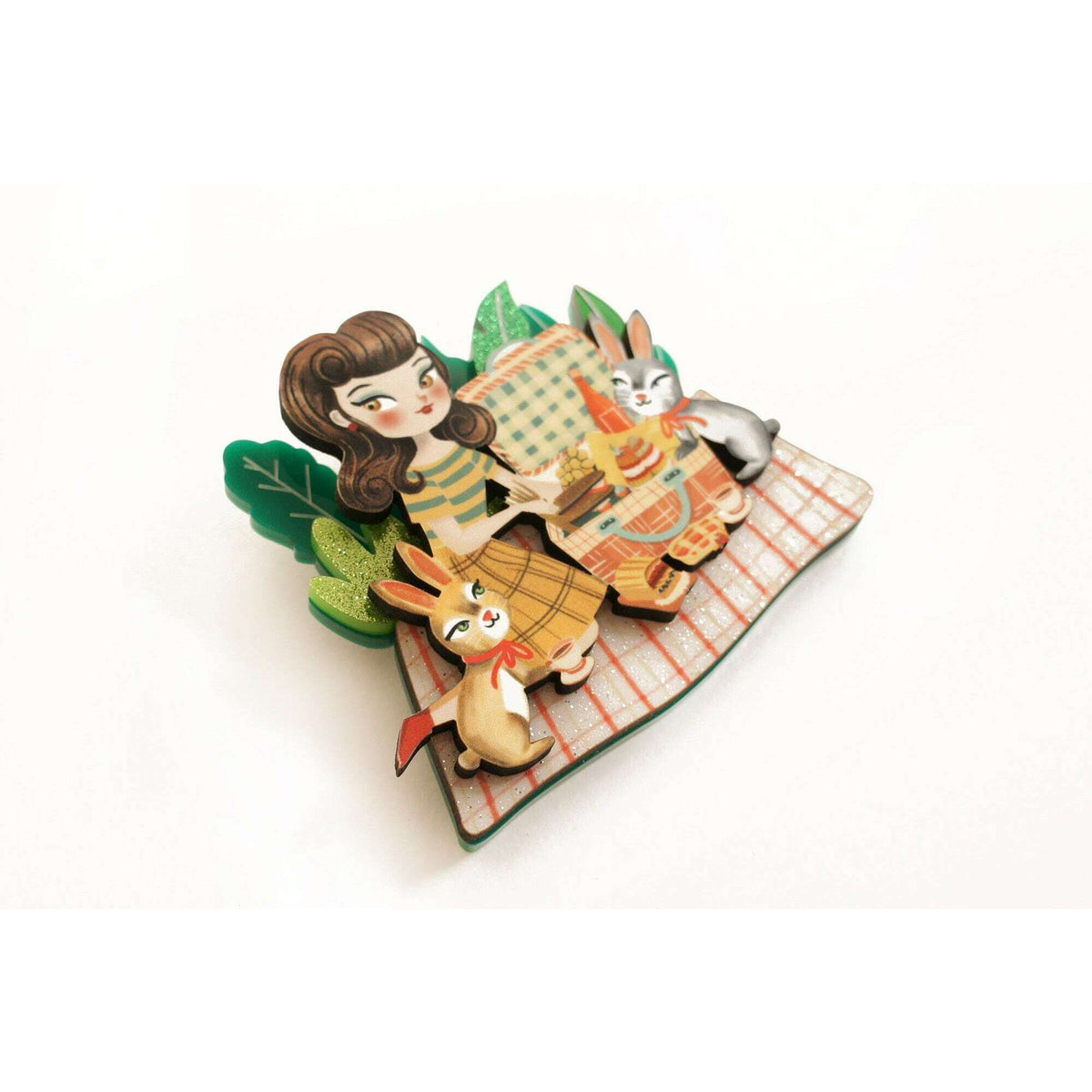 Picnic cartoon enamel brooch shaped like a blanket with girl and two rabbits