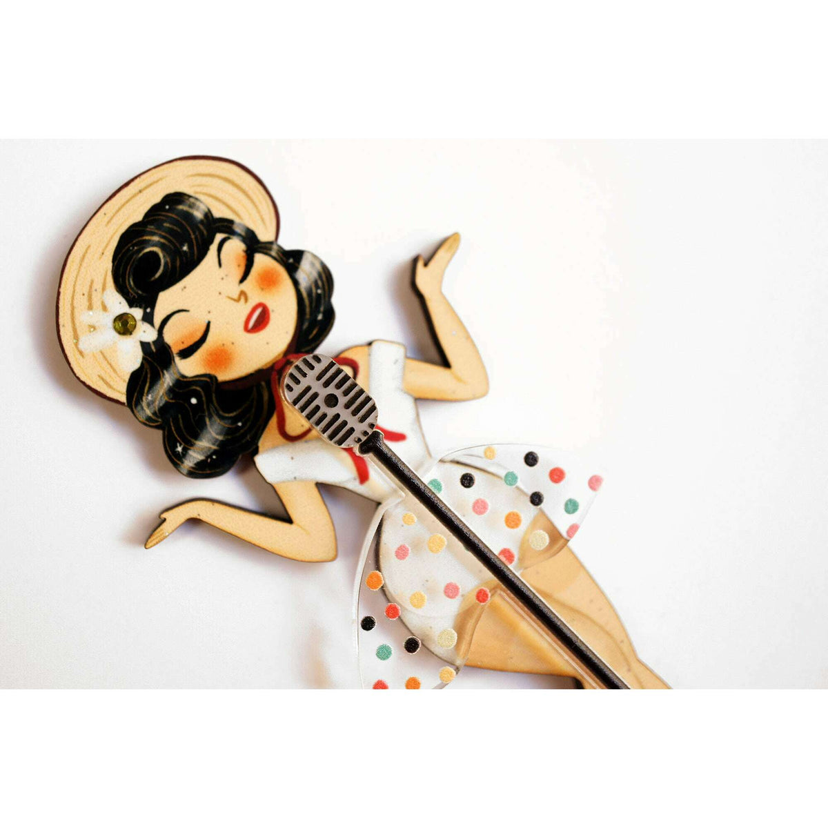 Pin-up singer enamel brooch featuring microphone and polka-dot skirt