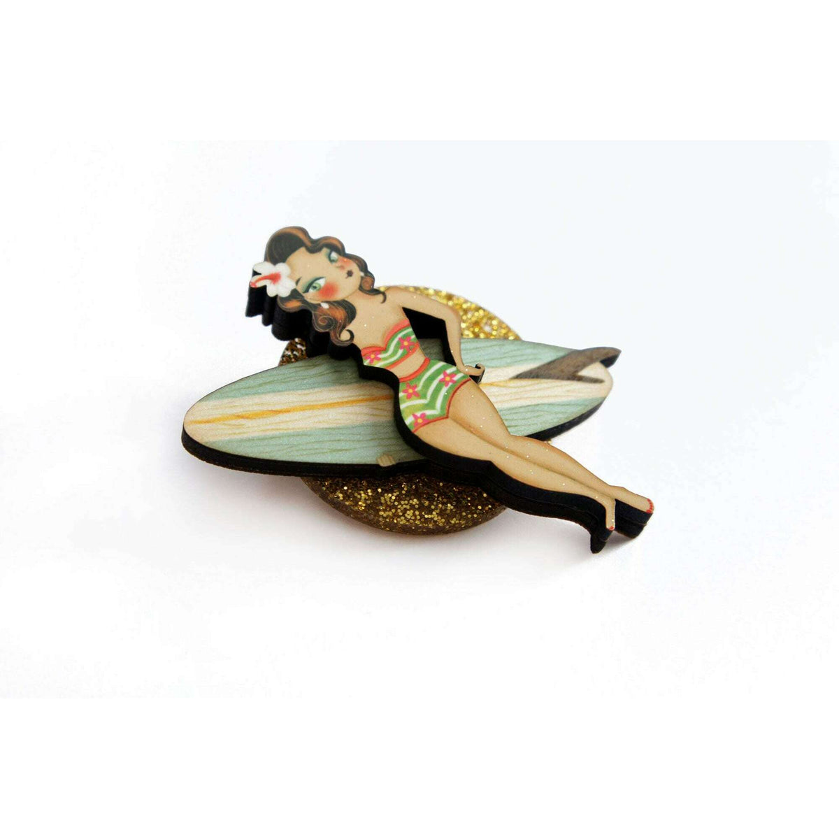 Surfer girl enamel brooch, gold glitter oval backing and teal surfboard-style wings