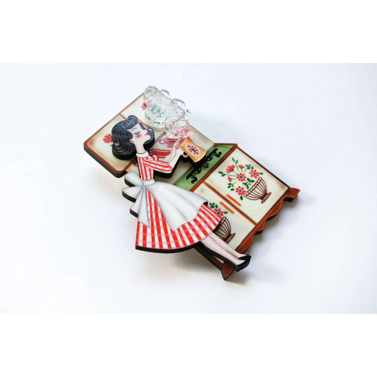 Tea pin up brooch illustration of a pin-up woman by a decorated tea table