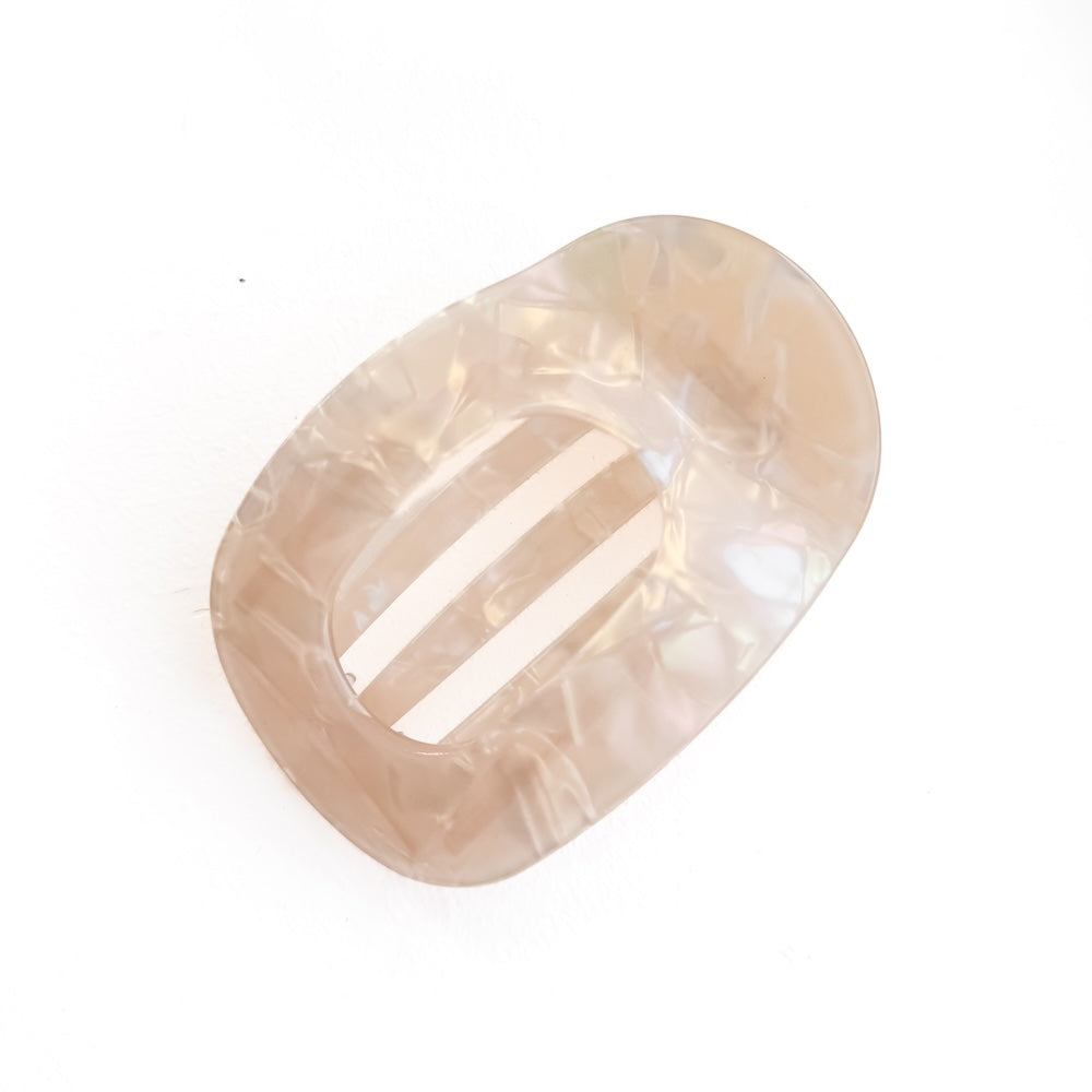 Large flat oval iridescent cream hair clip with center bar