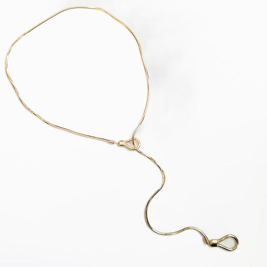 Gold-tone lariat toggle necklace with adjustable chain and oval toggle clasp