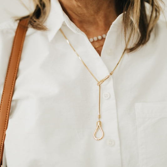 Gold-tone lariat toggle necklace with teardrop-style toggle clasp and long chain