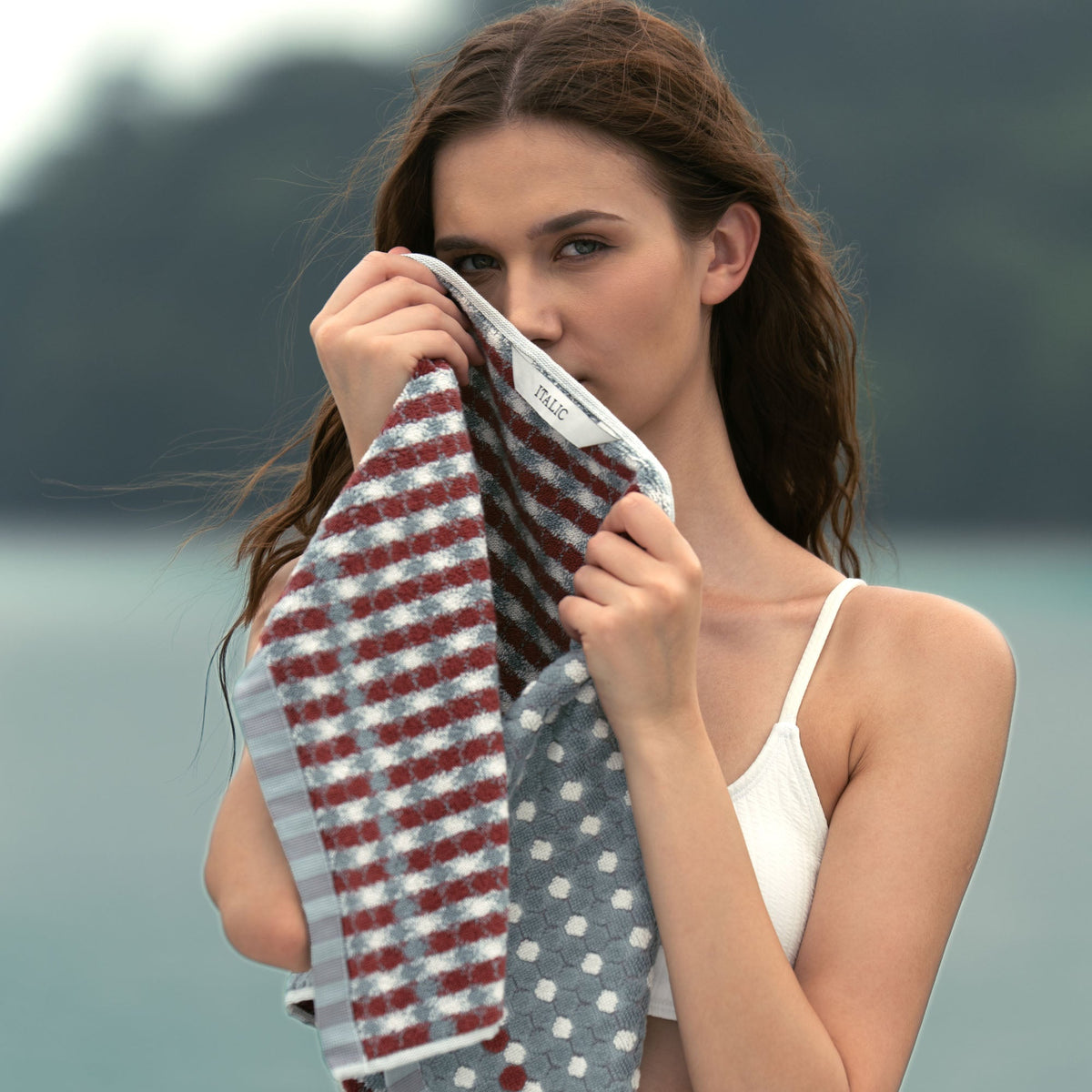 Cotton towel with white base, red-and-blue stripes and gray dot accents