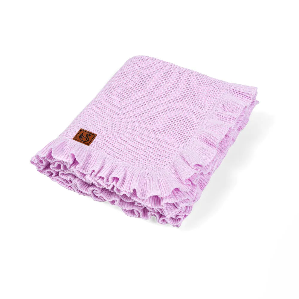Lilac knit baby blanket with ruffled edge and small logo patch