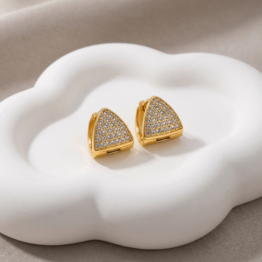 Gold-tone triangle pave zircon stud earrings, close-up