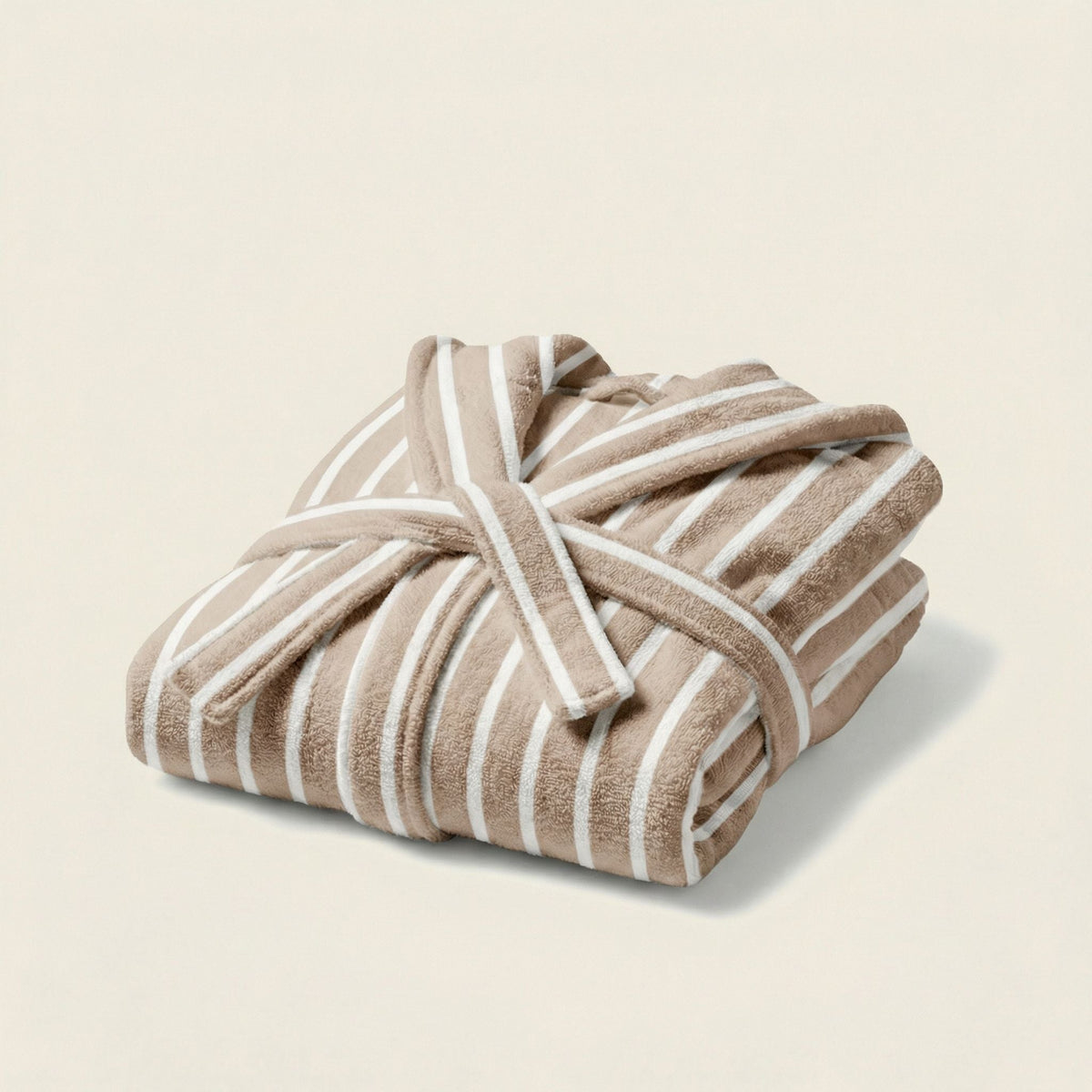 Folded beige-and-white striped hooded bathrobe with tie belt