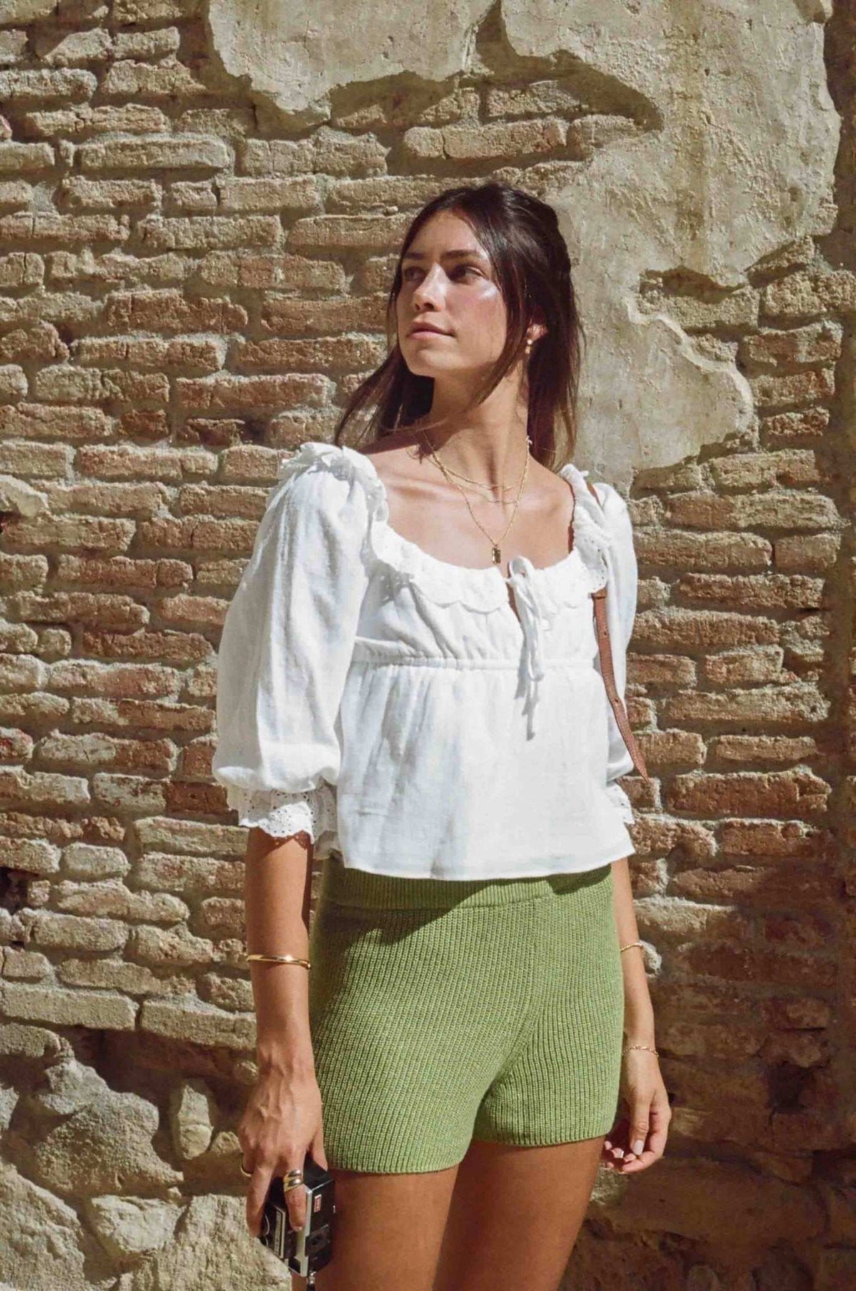 White cotton lace crop blouse with square yoke, drawstring ties, and puff sleeves