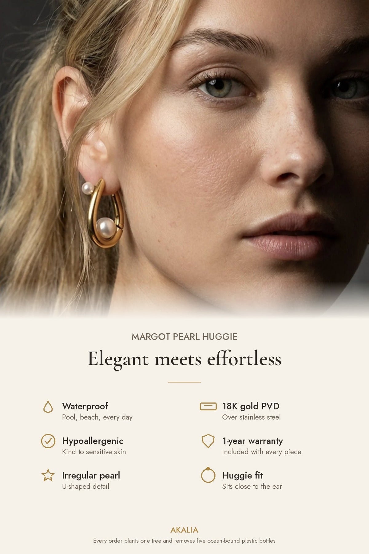 Gold-tone huggie hoop earrings with small white pearl detail, side view on model