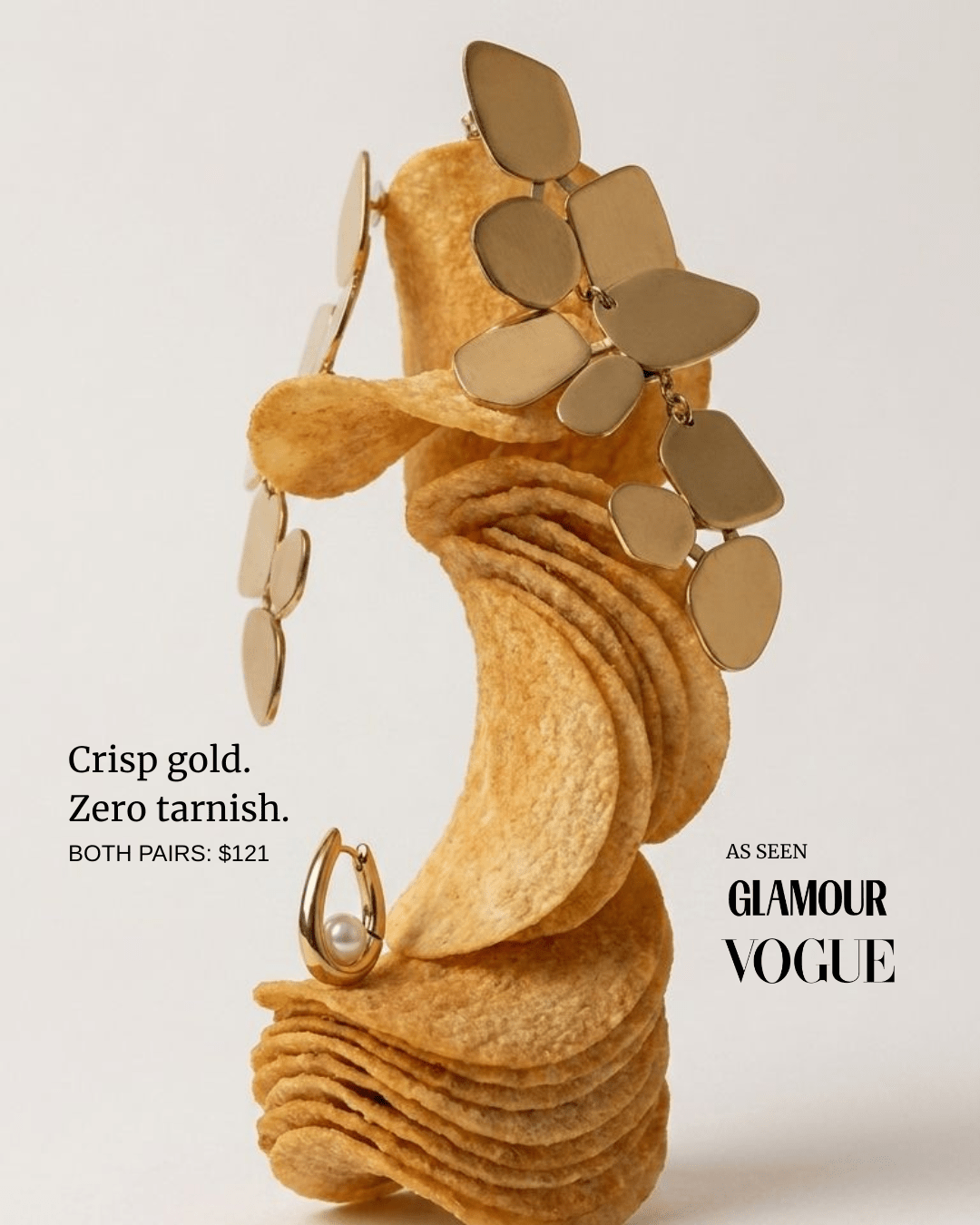 Gold-tone earrings with pearl huggie hoop detail and layered charm shapes on display